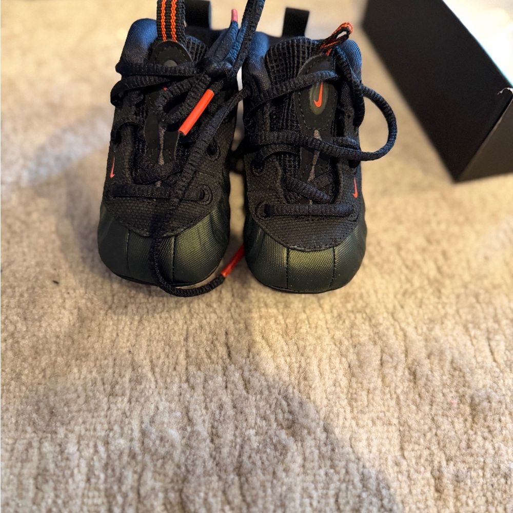 Nike Kids Black Sneakers with Orange Accents